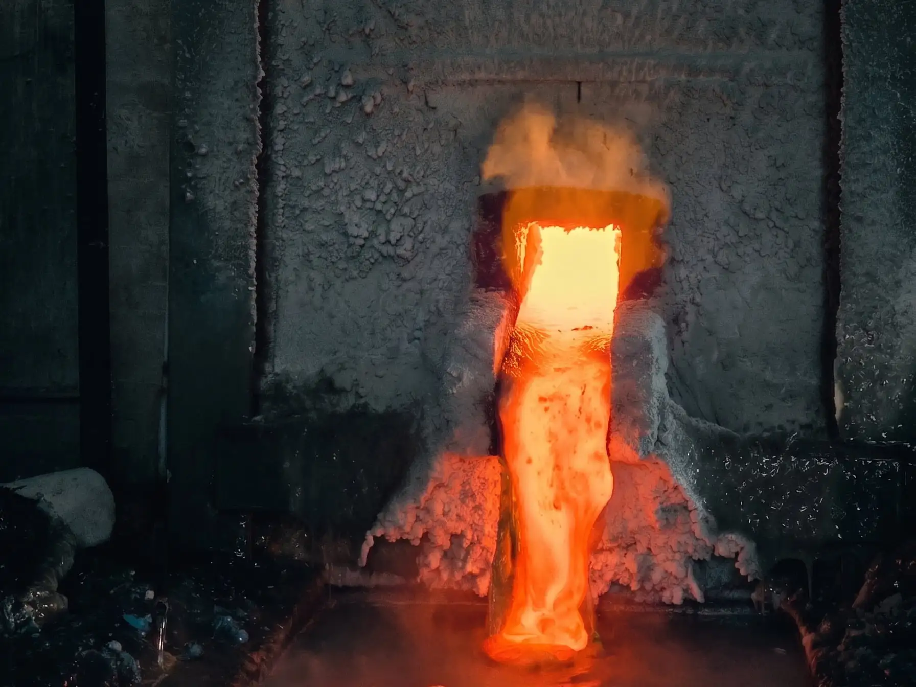 Molten sodium silicate running from the furnace tap hole at Arman Chemical.